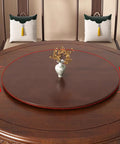 Hella Sturdy Solid Wood Lazy Susan Turntable For Kitchen Tables displayed on a round wooden table with a vase and decorative leaves.