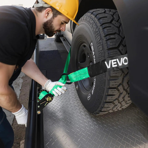 Heavy Duty Tire Safe Ratchet Strap Kit With Thick Rubber Blocks And Beefy Steel Hooks Secure Motorbikes And Atvs And Suvs Road Ready Tie Down System For Tough Hauls being used to secure a tire on a truck.