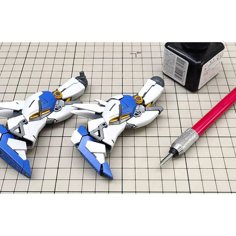 Professional Panel Line Pen And Infiltration Marker For Scale Plastic Model Kits with model parts and tools on grid.