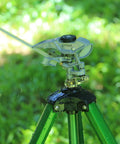 Heavy Duty Metal Impulse Sprinkler Head With Half Inch NPT Thread, Pulsating Sprinkler For Lawn, Yard, And Garden shown on tripod