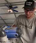 Man wearing Tough Safety Glasses With Side Shields Anti Fog Clear Lens ANSI Z87 Plus Certified Protective Eyewear working with tools.