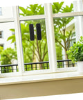 Super Strong Double Sided Hook And Loop Strips 100 Count Black Pet Film Fasteners With Sticky Back on window for home organization.