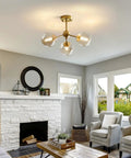 Living room with Amber Glass Bubble Sputnik Chandelier In Brass Gold Finish, 3 Light Semi Flush Mount Ceiling Light For Kitchen, Bedroom, Hallway, Soft Warm Glow And Modern Farmhouse Vibe