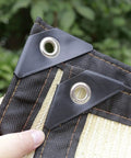 Close-up of Shade Cloth 7x7ft With 90 Percent Sun Blocking, Durable HDPE Shade Mesh Tarps showing grommets and taped edges.