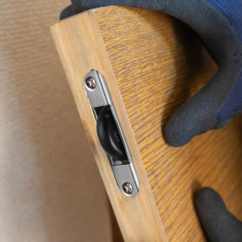 Heavy Duty Sliding Door Rollers Four Pack With Silky Nylon Wheels And Tough Steel Mounts For Closet Tracks visible in cabinet edge.