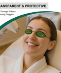 Total Game Changing IPL Eye Shields For Beauty And Spa Procedures Featuring Crazy Comfy Silicone Cushions And Crystal Clear Lenses Built Dang Tough To Block Laser And Led Glow Completely Includes 2 Pair - Model wearing green IPL eye shields during treatment.