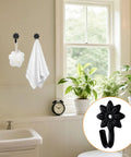 Heavy Duty Retro Flower Wall Hooks Eight Pack Slick Vintage Decorative Hardware Holds Up A Ton in a bathroom with towels.
