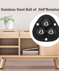 Self Adhesive Mini Caster Wheels 360 Degree Swivel For Small Appliances And Furniture Stainless Steel Rollers For Storage Bins And Trash Cans Low Height Elevation Quiet Smooth Movement Easy Install Non Marking On Floors 4 Pack Black shown installed on wooden furniture