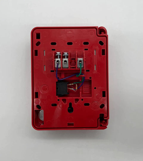 Back view of Kickass Addressable Pull Station For Tough Commercial Fire Alarm Systems, showing wiring connections and red plastic housing.