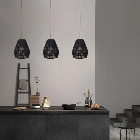7 Inch Woven Rattan Pendant Light Black Boho Basket Fixture For Farmhouse Kitchen Island, Bedroom, And Living Room Modern Hanging Lamp Set Of 3 With Hand Woven Natural Twine For A Cozy Vibe Glow in a kitchen setting.
