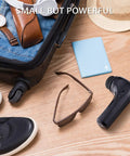 Portable Electric Shoe Cleaner And Polisher Brush Kit For Sneaker Upkeep With Dual Brush Heads Usb Powered in a travel setting.