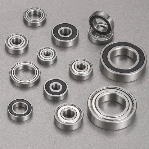 10 Pack S623ZZ Deep Groove Ball Bearings 3X10X4MM 440 Stainless Steel Grease Monkey Certified rust proof balls varying sizes on gray background.