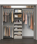 Super Slick Modular Closet Storage Organizer With Four Stackable Drawers In Taupe, featuring clothes, bags and organized compartments.
