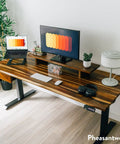 Heavy Duty Solid Hardwood Standing Desk With Seamless Under Desk Drawer And Effortless Adjustable Height Mechanism Featuring real walnut surface, dual monitor setup.