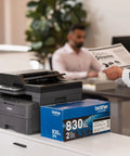 Compact Monochrome 3 In 1 Laser Printer With Copy Scan And Auto Duplex Wireless And Mobile Printing Alexa Compatible No Fuss Small Biz Workhorse For Home Office Use Includes Refresh Trial on office desk.
