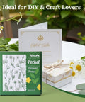 Mini Flower Press Kit For Small Blooms And Leaves, packaging and contents shown on a table with flowers and a gift box.