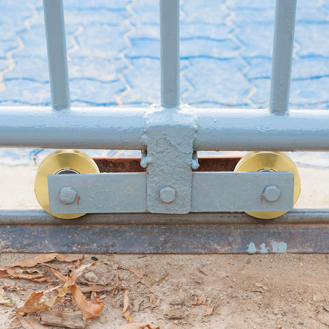Solid 4 Inch V Groove Gate Wheel Set Heavy Duty Sliding Gate Rollers One And Three Quarters Inches Width Caster Wheels with gate installed