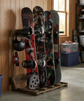 Rustic Burnt Wood Freestanding Surfboard Rack, 4 Foot Tall Vertical Stand For Indoor Storage with colorful boards in garage.