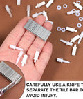 GameChanger Plantation Shutter Repair Kit Features 125 Piece Heavy Duty Louver Staple Set with metal staples and plastic pins in hand.