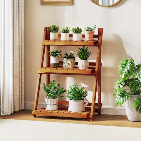 Foldable 3 Tier Ladder Plant Stand Made Of Solid Wood For Indoor Outdoor Use Space Saving Corner Shelf showcasing potted plants outdoors