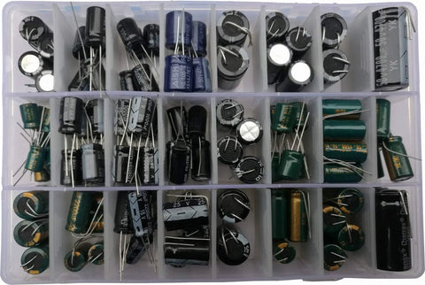 No Fluff 124 Piece Radial Electrolytic Capacitor Assortment Kit With Heavy Duty Aluminum Parts Spanning 22Uf To 4700Uf And 6 3V To 450V organized in a transparent storage box.