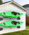 Built Like A Tank Wall Mount Kayak Storage Rack With Paddle Hooks, two green kayaks mounted on a white wall.