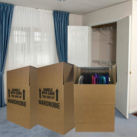 Space Saver Wardrobe Moving Boxes With Hanger Pack Of 3 Shorty Wardrobe Boxes 20x20x34 Inches set in front of a closet.