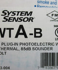 Label of System Sensor 4WTA-B photoelectric smoke detector with thermal sensor, plug-in design, integrated sounder, 12/24 VDC.