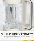 Close-up of Electric Kettle With Removable Stainless Steel Tea Infuser And Glass Carafe 1.7L, displaying boiling water