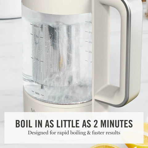 Close-up of Electric Kettle With Removable Stainless Steel Tea Infuser And Glass Carafe 1.7L, displaying boiling water