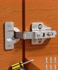Full Overlay Soft Close Cabinet Hinges 20 Pack installed with screwdriver, showing adjustable clip-on concealed hardware.
