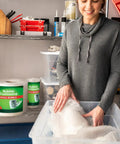 Woman packing with Pro Grade Small Bubble Cushioning Wrap For Moving And Shipping, 175 Ft Perforated Bubble Roll With Tiny Bubbles