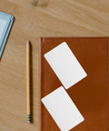 Straight Up Premium White Pvc Cards Bulk Pack Standard Eighty Five By Fifty Four Millimeter Size Ideal For Double Sided Id Printing Custom Employee Badges Smooth Banking Swipes Ready To Roll on leather notebook with pencil.