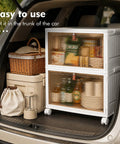 Heavy Duty 28 Quart Stackable Storage Totes With Roll Along Wheels Premium Plastic Home Stash Organizer in car trunk.