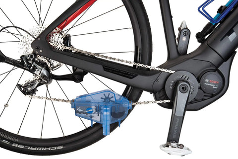Cyclone Chain Scrubber CM-5.3 In Blue For All Multi-Speed Bikes attached to bicycle chain for fast and thorough cleaning.