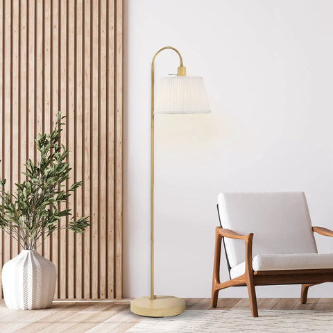 52 Inch Floor Lamp With Faux Wood Finish And White Pattern Shade Japandi Style next to armchair in modern living room.
