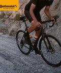 Cyclist riding off-road with Cross 28 Butyl Cyclocross Bike Inner Tubes Pair For 700C Wheels 32-47c With 60mm Presta Valve Deep Rim