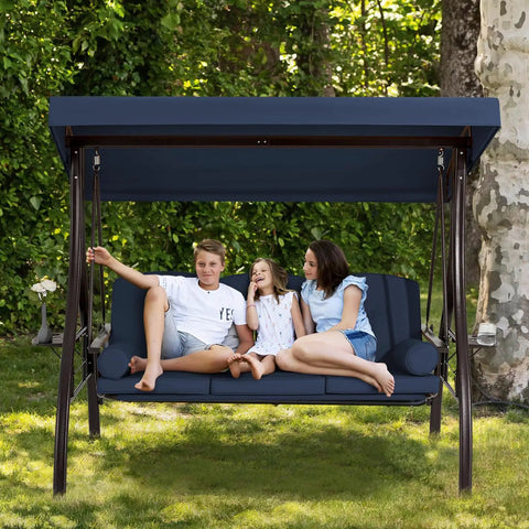 Three Seat Outdoor Porch Swing With Upgraded One And A Half Inch Cup Holder Comfy Adjustable Canopy And Backrest Cushions Weatherproof Steel Frame For Garden Deck Or Poolside Blue with three people sitting.