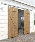 Premium 24ft Heavy Duty Galvanized Steel Exterior Sliding Barn Door Hardware Kit Featuring Rust Free Track Rollers installed on wooden doors.