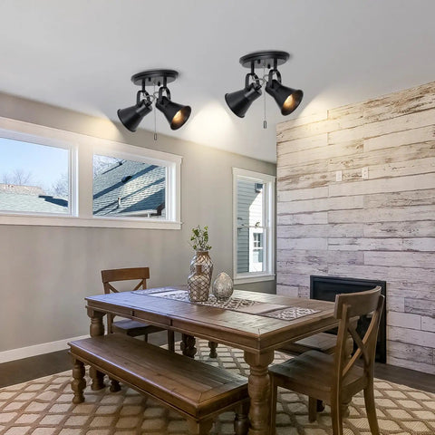 Dining room with wood table and two light black track lighting with pull chain, industrial adjustable ceiling light fixtures.
