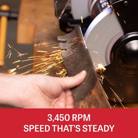 Eight Inch Bench Grinder With Integrated Led Work Lights And Built In Coolant Tray powered, sharpening a blade at 3450 RPM with sparks.