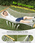 Double Handwoven Rope Hammock For Two With Spreader Bar No Stand Indoor Outdoor Use For Patio Poolside Backyard White 74.8 By 55.1 Inch Bed And 122 Inch Total Length Supports Up To 450 Lbs with person relaxing outdoors