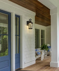 Heavy Duty Led Motion Sensor Outdoor Wall Light With 800 Lumens Super Bright 3000K Warm White Glow, Dusk To Dawn Safety Switch, Rugged Black Metal And Clear Water Glass Finish For Secure Front Porch Garage Shed Illumination That Hits Just Right, mounted on a white porch wall.