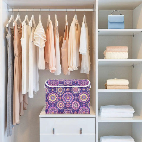 Totally Solid Collapsible Storage Bins With Lids And Heavy Duty Handles For Bedroom Closet Organization in a closet with clothes.