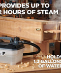Pro Grade Wood Bending Steam Generator with 1.3 Gallon Tank and 12 Foot Hose in use, connected to wooden steam box in workshop.