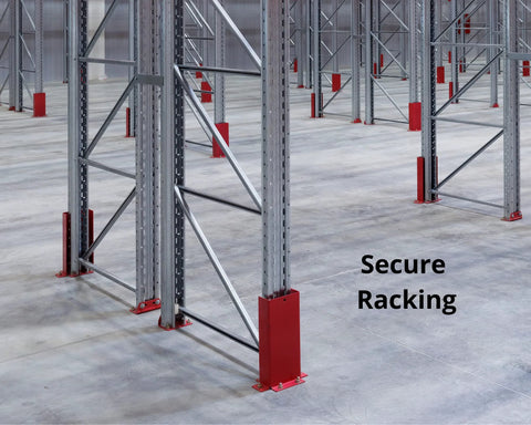 Industrial warehouse floor with metal racking and red protective guards for secure racking installation.