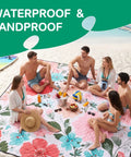 Group sitting on floral Waterproof Extra Large Picnic Blanket For Outdoor Activities Great For Beach And Camping Mat