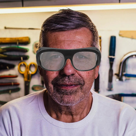 Man wearing Badcas Steampunk Welding Goggles with Flip up Lenses for Spark and Debris Defense 6 Pack Bundle in workshop.