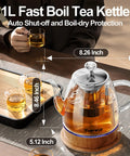 Glass Electric Kettle With Removable Stainless Steel Infuser 1 Liter Dual Purpose For Tea Coffee And Hot Water Auto Shut Off Boil Dry Protection BPA Free Easy Pour Design on a table with tea cups