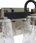 Close-up of Three Light Vanity Fixture With Seeded Glass Diffusers Matte Black Finish With Polished Nickel Accents, Sleek Design
